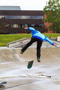 CALGARY, CANADA - JUN 21, 2015: Athletes have a friendly skateboard competition in Calgary. California law requires anyone under the age of 18 to wear a helmet while riding a skateboard.