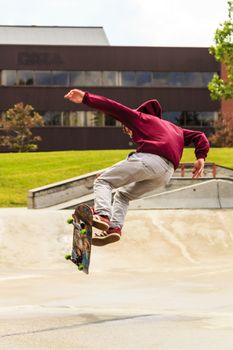 CALGARY, CANADA - JUN 21, 2015: Athletes have a friendly skateboard competition in Calgary. California law requires anyone under the age of 18 to wear a helmet while riding a skateboard.