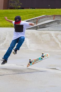 CALGARY, CANADA - JUN 21, 2015: Athletes have a friendly skateboard competition in Calgary. California law requires anyone under the age of 18 to wear a helmet while riding a skateboard.