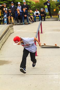 CALGARY, CANADA - JUN 21, 2015: Athletes have a friendly skateboard competition in Calgary. California law requires anyone under the age of 18 to wear a helmet while riding a skateboard.