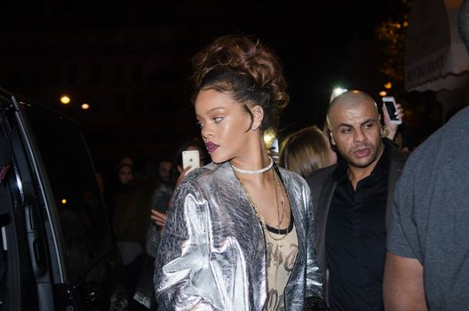 FRANCE, Paris : In France for the Paris Fashion Week, star singer Rihanna enters a club, near the Champs-Elys�es, in Paris, on the night between October 1st and October 2, 2015. 