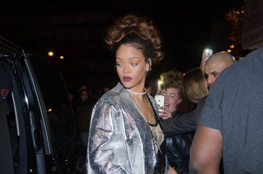 FRANCE, Paris : In France for the Paris Fashion Week, star singer Rihanna enters a club, near the Champs-Elys�es, in Paris, on the night between October 1st and October 2, 2015. 