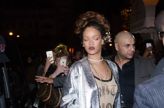 FRANCE, Paris : In France for the Paris Fashion Week, star singer Rihanna enters a club, near the Champs-Elys�es, in Paris, on the night between October 1st and October 2, 2015. 