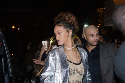 FRANCE, Paris : In France for the Paris Fashion Week, star singer Rihanna enters a club, near the Champs-Elys�es, in Paris, on the night between October 1st and October 2, 2015. 
