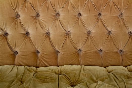 Brown couch background texture with sunken buttons
