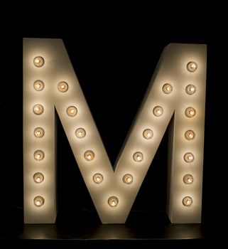 modern lighting "M" alphabet isolated on black background