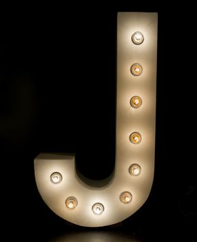 modern lighting "J" alphabet isolated on black background