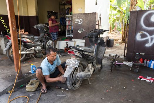 BALI, NUSA PENIDA ISLAND, INDONESIA - JULY 28.2015: Street motorbike service in Toyapakeh. Nusa Penida July 27. 2015 Indonesia