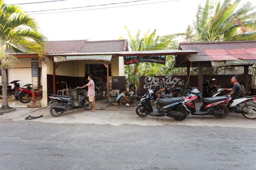 BALI, NUSA PENIDA ISLAND, INDONESIA - JULY 28.2015: Street motorbike service in Toyapakeh. Nusa Penida July 27. 2015 Indonesia