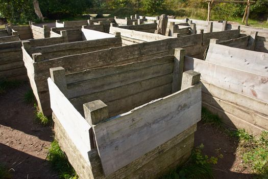 Maze labyrinth made from wood in a nature playground                               