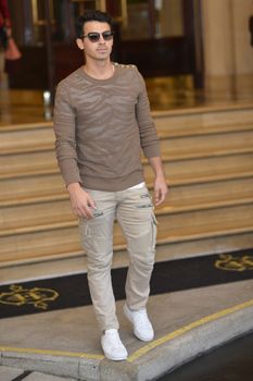 FRANCE, Paris : Famous singer Joe Jonas enters InterContinental hotel in Paris on October 1st, 2015 for Paris Fashion week. 