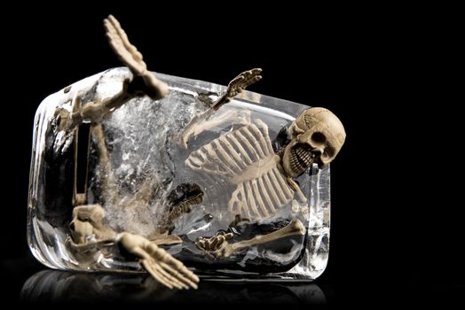 Death in ice concept, Skull in ice isolated on black background