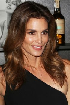 UNITED KINGDOM, London: Cindy Crawford attends the joint launch of George Clooney's new tequila label, Casamigos Tequila, and Crawford's new book Becoming at the Beaumont Hotel in central London on October 1, 2015. 
