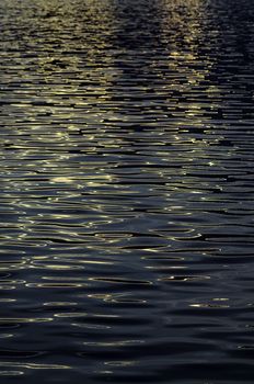 Sea wave reflected with sunset light, Abstract background