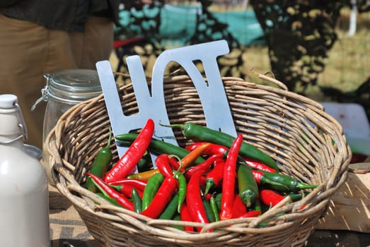 Hot red and green Chillies in Wicker Basket