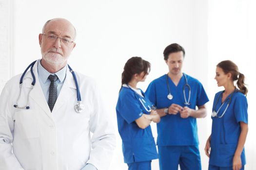 Professional team of doctors and nurses on white background