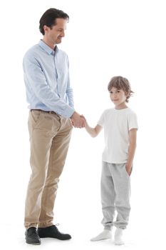 Cheerful father and son shaking hands isolated on white background