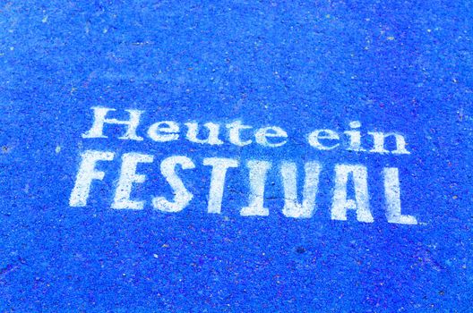 Today a festival marked on a tarmac road in blue color.