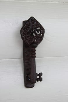 iron mechanical doorbell in a retro style on a wooden wall