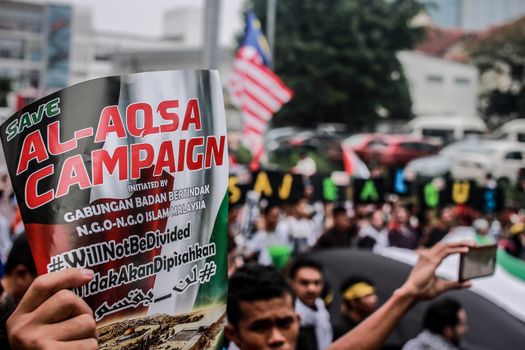 MALAYSIA, Kuala Lumpur: A close up of a sign calling for justice at a rally in front of US Embassy in Kuala Lumpur, Malaysia on October 2, 2015. Protesters urge Americans to act against its ally Israel following clashes at Al-Aqsa mosque, between Israeli security forces and Palestinians Muslims.These pictures show hundreds of people holding signs, banners and waving flags as they parade in the Malaysian capital.