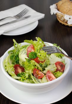 Light summer salad of lettuce with arugula and cherry tomatoes