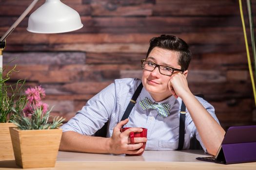 Lesbian woman with eyeglasses and hand on cheek