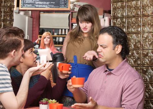 Dissatisfied customers and waitress at coffee house