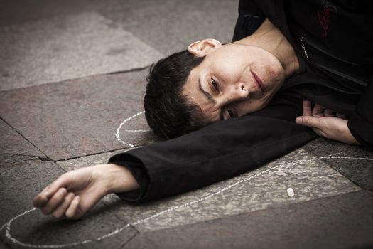 SPAIN, Madrid: Women dressed in all black feign their own death in downtown Madrid as part of a performance protest, on October 2, 2015, denouncing gender-based violence. 