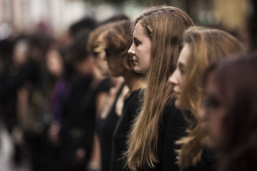 SPAIN, Madrid: Women dressed in all black feign their own death in downtown Madrid as part of a performance protest, on October 2, 2015, denouncing gender-based violence. 
