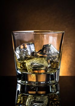 glass of whiskey on black table with reflection, warm atmosphere dark light, time of relax with whisky