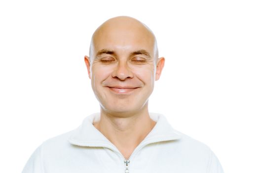 Bald smiling man with his eyes closed. Isolated on white. Studio