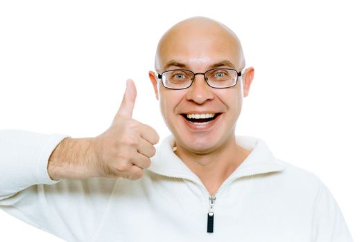 Bald man with glasses smiling with thumb up. Isolated on white. Studio