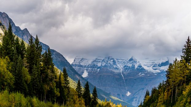 Mount Robson in the Provincial Park named after it. Mount Robson is the highest peak in the Canadian Rockies at an elevation of 3,954 m (12,972 ft). Because of its height the mountain peak is often shrouded in the clouds.