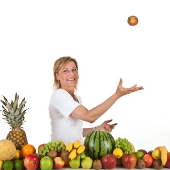 Many fruits stacked together and cute woman