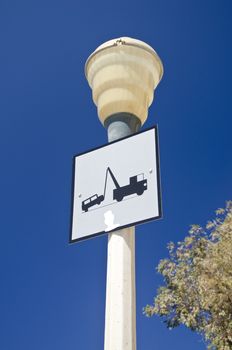 Lamp post with a traffic sign in Greece