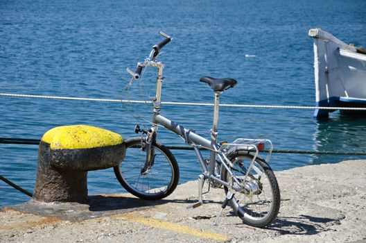 Bike besides bollard in harbor