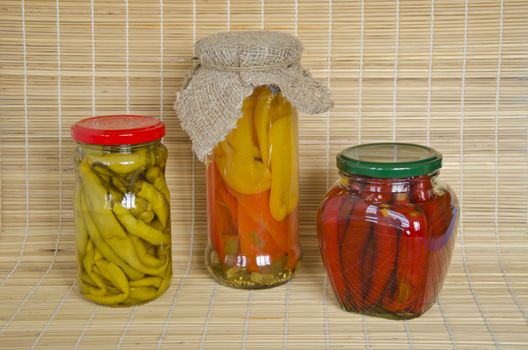 Homemade preserves perpers with cloths in 3 jars