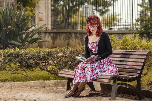 View of pinup young woman in vintage style clothing