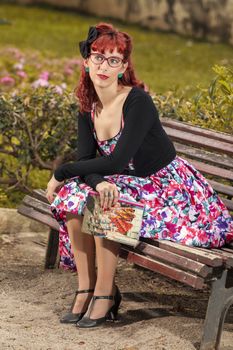 View of pinup young woman in vintage style clothing