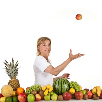 Many fruits stacked together and cute woman