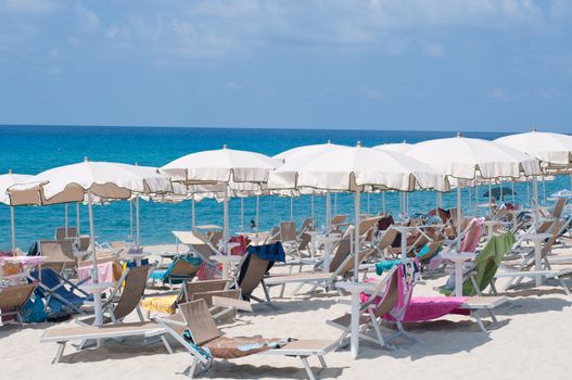 Many umbrellas and chairs at a resort in southern Italy