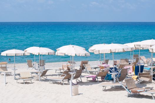 Many umbrellas and chairs at a resort in southern Italy