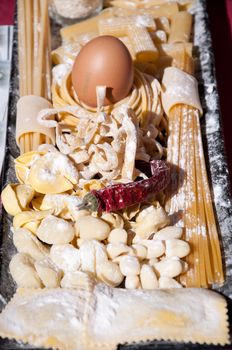 Pasta of various sizes with tomato .pepper and eggs