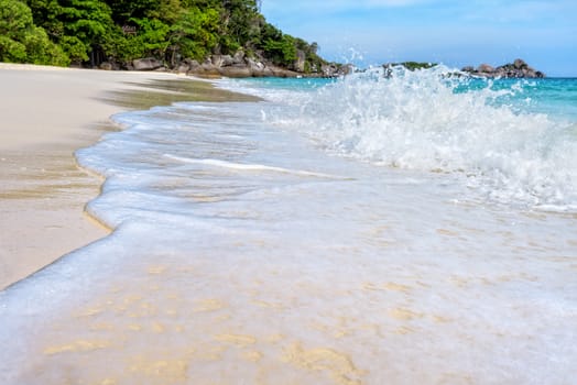 Beautiful landscape blue sea white sand and waves on the beach during summer at Koh Miang island in Mu Ko Similan National Park, Phang Nga province, Thailand