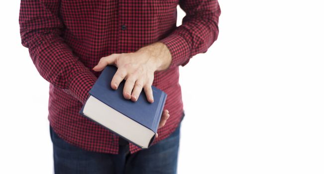 Man holding large closed book with blank cover, isolated on a white background