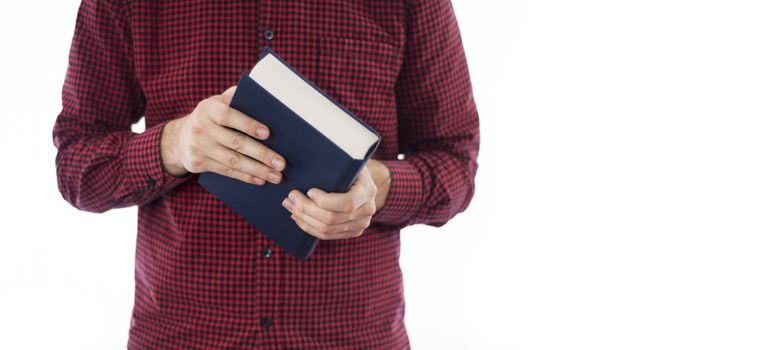 Man holding large closed book with blank cover, isolated on a white background