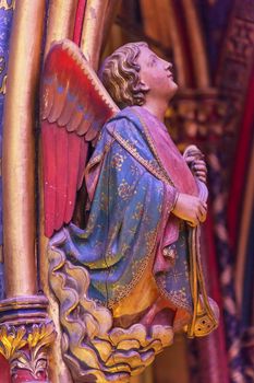 Angel Wood Carving Cathedral Saint Chapelle Paris France.  Saint King Louis 9th created Sainte Chappel in 1248 to house Christian relics, including Christ's Crown of Thorns.  Stained Glass created in the 13th Century and shows various biblical stories along wtih stories from 1200s.