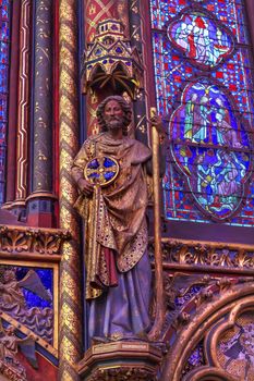 Knight Wood Carving Stained Glass Cathedral Saint Chapelle Paris France.  Saint King Louis 9th created Sainte Chapelle in 1248 to house Christian relics, including Christ's Crown of Thorns.  Stained Glass created in the 13th Century and shows various biblical stories along wtih stories from 1200s.