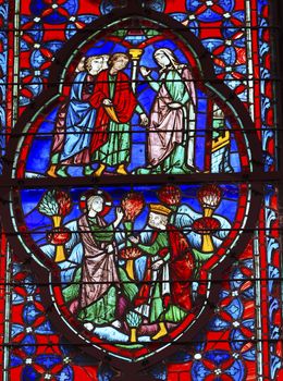 King Christ Mary Stained Glass Saint Chapelle Paris France.  Saint King Louis 9th created Sainte Chapelle in 1248 to house Christian relics, including Christ's Crown of Thorns.  Stained Glass created in the 13th Century and shows various biblical stories along wtih stories from 1200s.