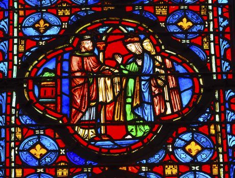 King Queen Stained Glass Saint Chapelle Paris France.  Saint King Louis 9th created Sainte Chapelle in 1248 to house Christian relics, including Christ's Crown of Thorns.  Stained Glass created in the 13th Century and shows various biblical stories along with stories from 1200s.